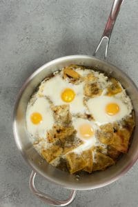 Bake Chilaquiles until whites are set and yolks are done