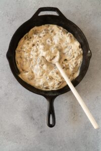 Mixing Paleo Cream Sauce with Sausage